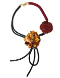 Black and red long necklace with flower and medal